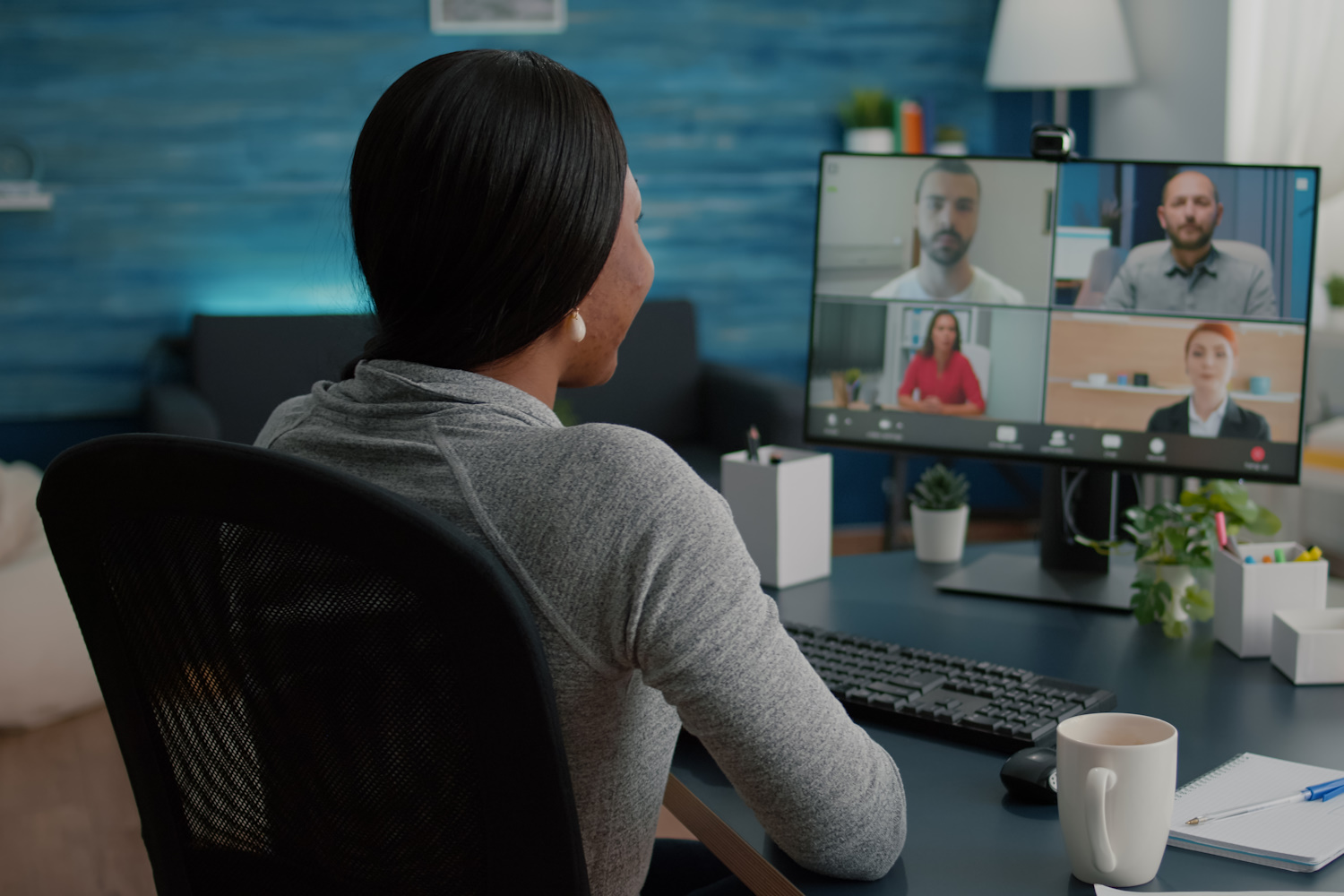 Black student discussing marketing academic ideas with college team having virtual teleconference